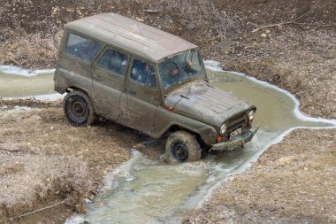 Old SUV car riding outdoors