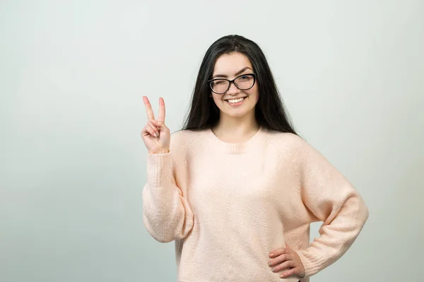 Young Caucasian Girl Glasses Showing Victory Sign Winking White Background — 스톡 사진