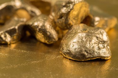 Close up of gold gemstones 