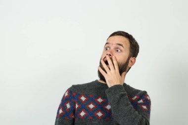 Shocked bearded caucasian man on white background 