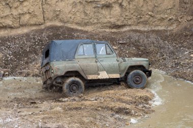 SUV car riding dirty road outdoors