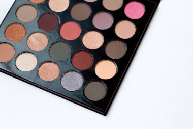 make up palette with eye shadows on white background