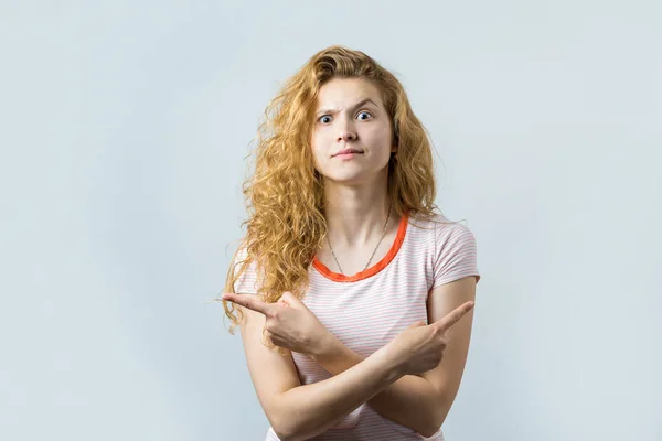 Young Caucasian Blonde Curly Girl Pointing Wit Fingers White Background — 스톡 사진