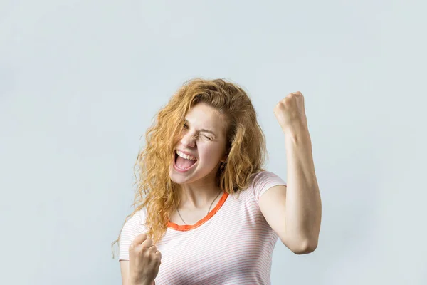 Young Excited Caucasian Blonde Curly Girl Celebrating White Background — Zdjęcie stockowe