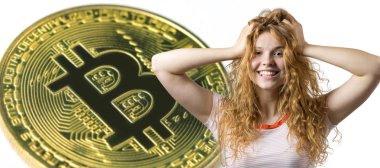 Beautiful young caucasian girl on white background with crypto coin