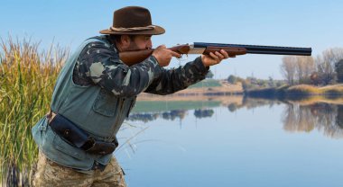 Ormanda tüfekli bir avcı.