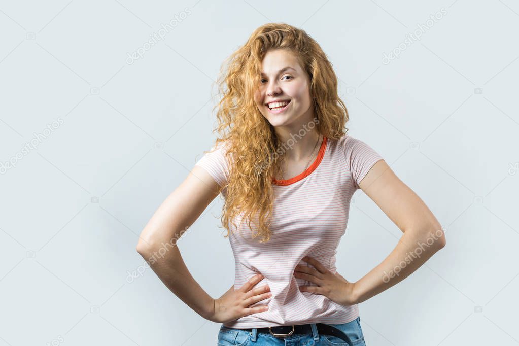 portrait of a beautiful young woman with long hair on a white background