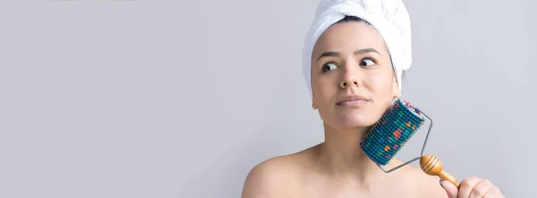 Brunette Towel Her Head Using Roller Face Massage Isolated Grey — Stock Photo, Image