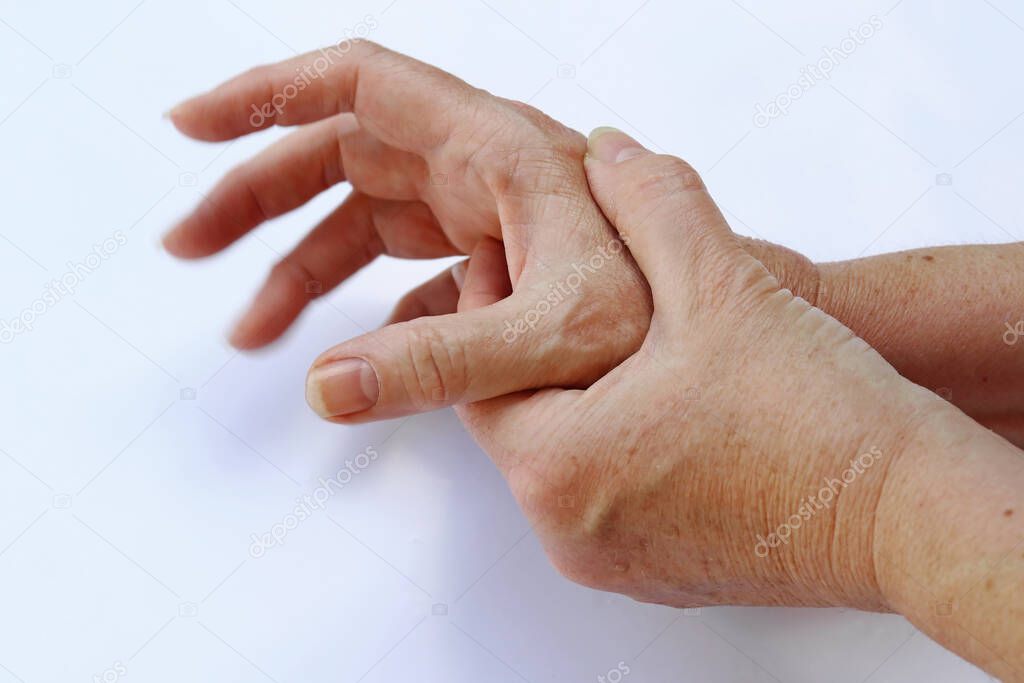 The hands of a woman with Parkinson's disease tremble very strongly
