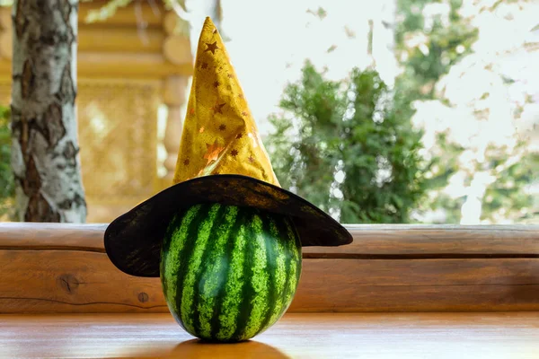 Big Ripe Striped Watermelon Witch Hat Wooden Bench Outdoor Preparation — Stock Photo, Image