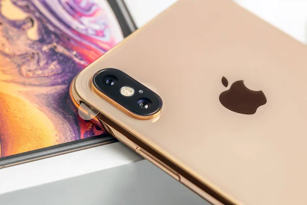 12th October,2018-Kiev,Ukraine: Latest Iphone XS on opened box on white table. Newest Apple smartphone on white branded box in mobile store. Modern gadget with dual camera and OLED screen for sale — Stock Photo, Image