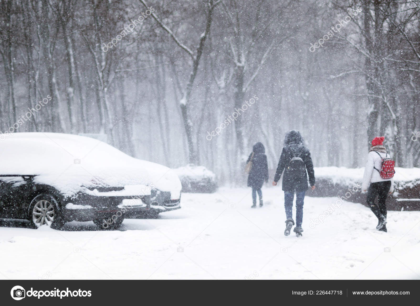 picture Blizzard Heavy Snow Pictures https depositphotos com 226447718 stock photo people walking through city street html