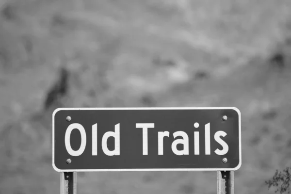 Ghost Town of Old Trails Sign on Route 66 in the Sonoran Desert, Arizona USA in Black and White