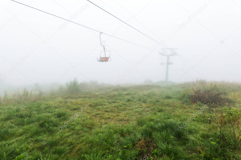 Chair lift in the fog