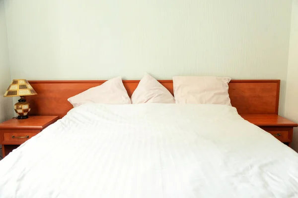 A double bed in the hotel room. Stock Photo