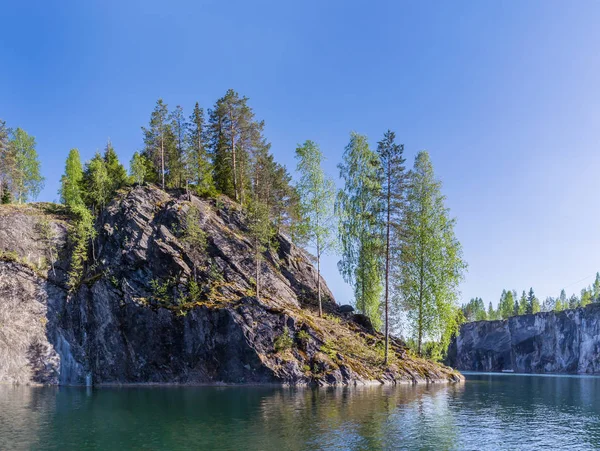 Stone peninsula in the great career of Ruskeala, Russia