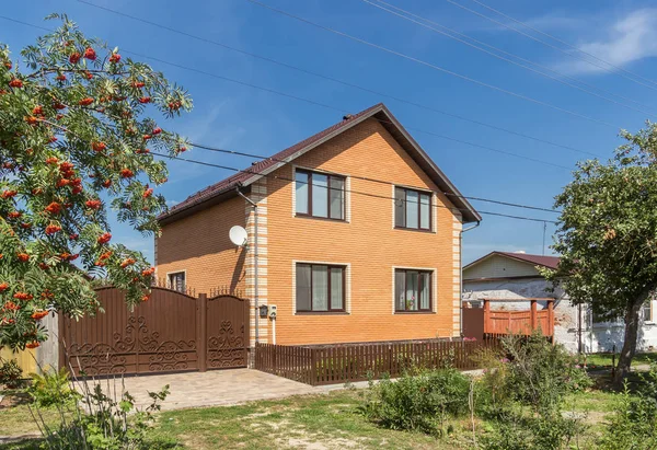 Two-storey brick house in the village, Russia