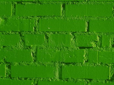 Yeşil, yeni boyanmış tuğla duvar. 