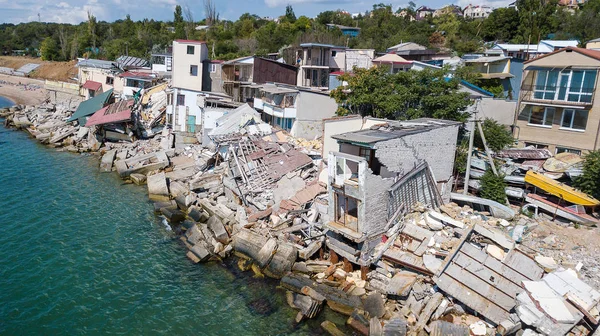 The destroyed house after the earthquake on the seashore.