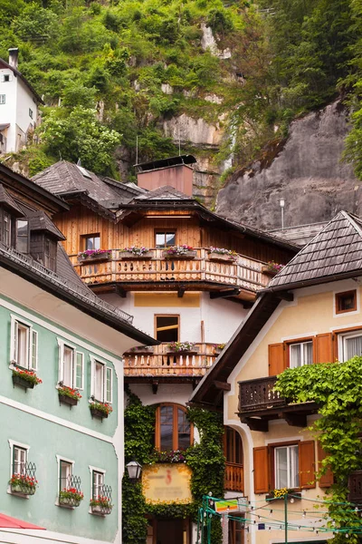 Old vintage wooden houses on the hills in Hallstatt, Austria.