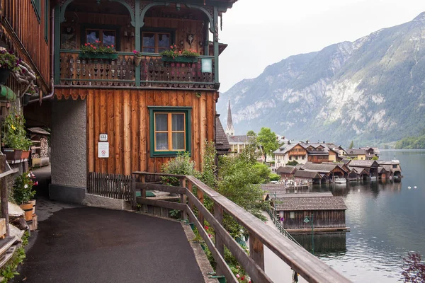 Old vintage wooden houses by the lake in Hallstatt, Austria.