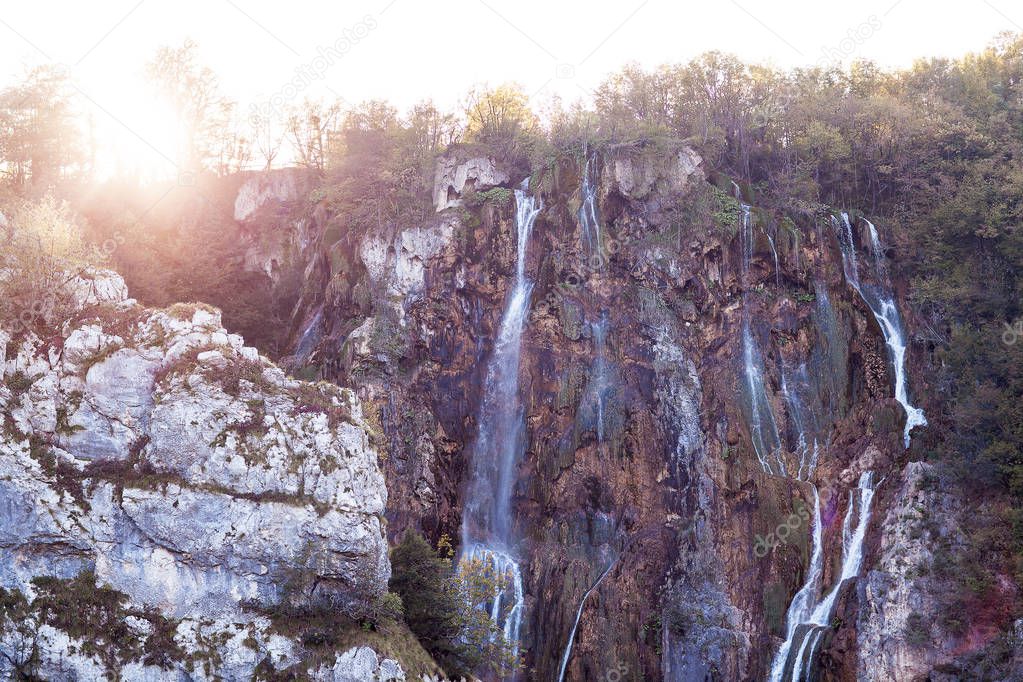 Water that falls from a large waterfall over stone slopes, Plitvice Lakes