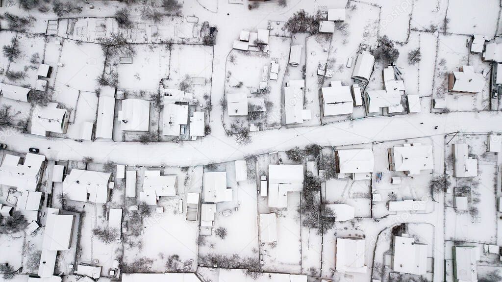 Aerial view of houses in poor areas of Ukraine in a village in winter.