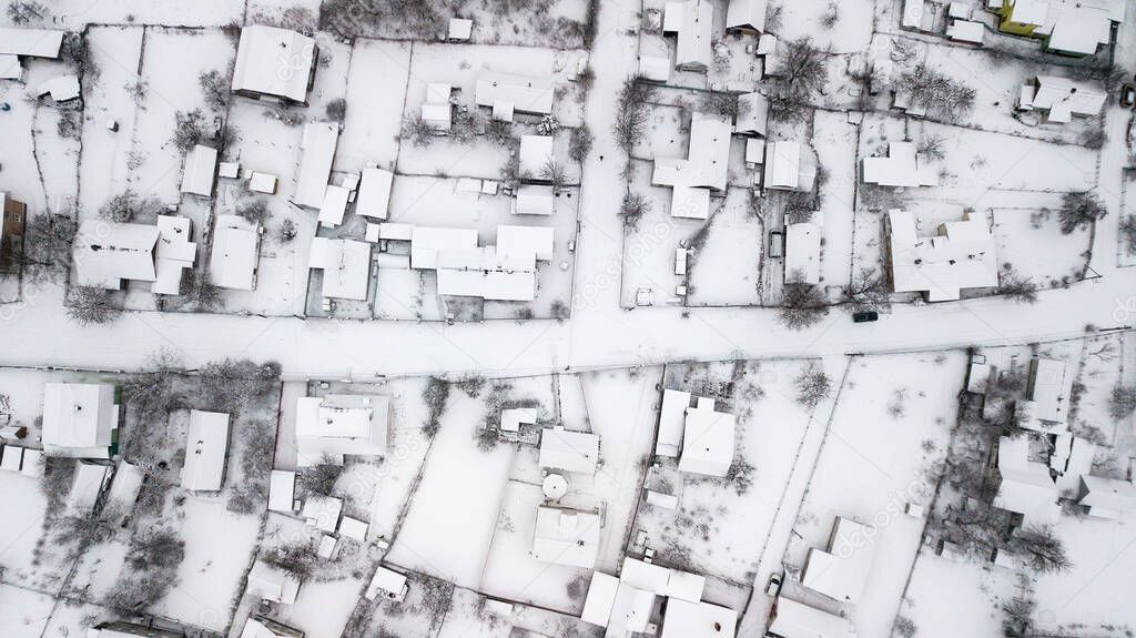 Aerial view of houses in poor areas of Ukraine in a village in winter.