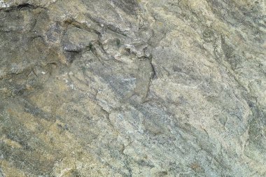 Arka plan deseni, doğal tozlu kahverengi taş zemin veya doku ile dekore edilmiş metin için kopya yer.