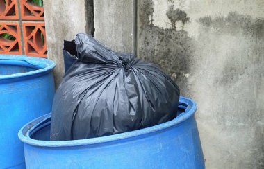 Garbage Bag in Plastic Buckets or Garbage Bin