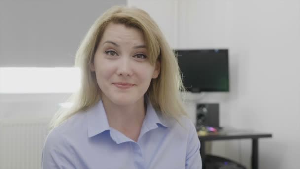 Pleased and assertive corporate young woman in the office accepting offer showing yes positive sign shaking head and smiling — Stock Video