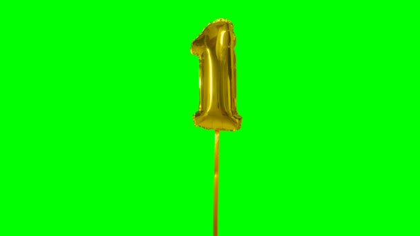 数字1一年生日纪念日金色气球漂浮在绿色屏幕上 — 图库视频影像