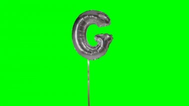 Alfabe gümüş helyum balon yüzen gelen mektup G yeşil ekran üzerinde