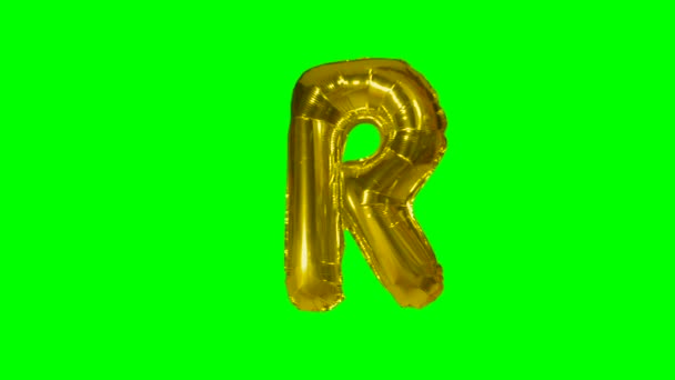 緑色の画面に浮かぶアルファベット ゴールドのヘリウム風船から大きな文字 — ストック動画