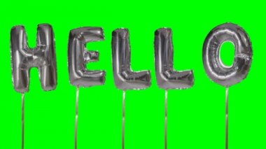 Word Merhaba gümüş helyum balon harfler yeşil ekranda kayan dan