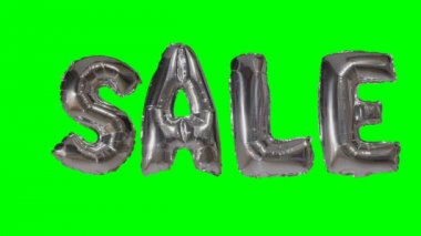 Yeşil ekran üzerinde yüzen gümüş helyum balon harfler satışından Word
