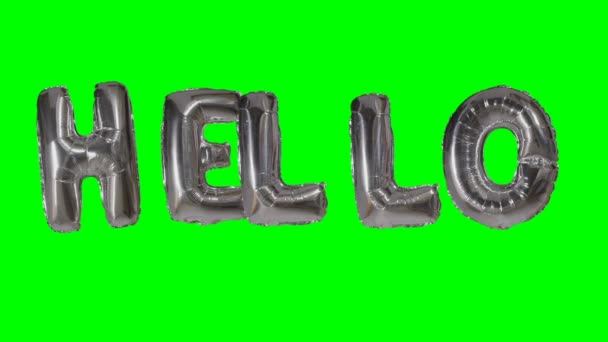 Wort hallo aus Helium silbernen Luftballon Buchstaben schweben auf grünem Bildschirm — Stockvideo