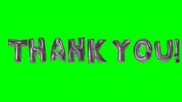 Word thank you from helium silver balloon letters floating on green screen — Stock Video