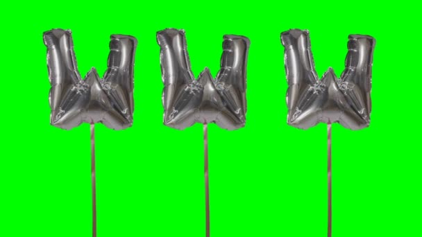 Word www web internet from helium silver balloon letters floating on green screen — Stock Video