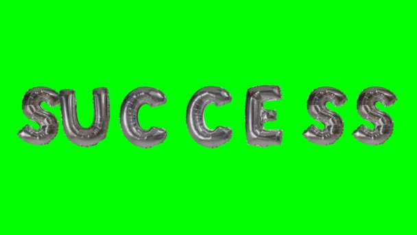 Word success from helium silver balloon letters floating on green screen — Stock Video