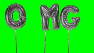 Word Omg gümüş helyum balon harfler yeşil ekran üzerinde yüzen üzerinden