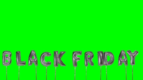 Word black friday from helium silver balloon letters floating on green screen — Stock Video