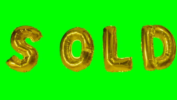 Palavra vendida de letras de balão de ouro de hélio flutuando na tela verde — Vídeo de Stock