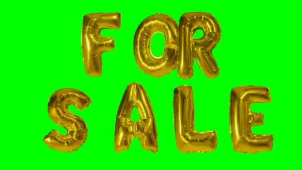 Word for sale from helium gold balloon letters floating on green screen — Stock Video