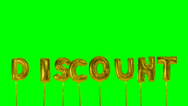 Word discount from helium golden balloon letters floating on green screen — Stock Video