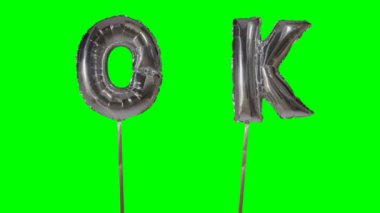 Word Tamam gümüş helyum balon harfler yeşil ekran üzerinde yüzen üzerinden