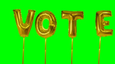 Yeşil ekran üzerinde yüzen altın helyum balon harfler kelime oy