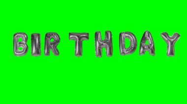 Word doğum--dan yeşil ekran üzerinde yüzen gümüş helyum balon harfler