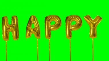 Word mutlu yeşil ekran üzerinde yüzen altın helyum balon harfler üzerinden