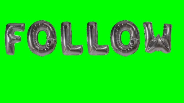 Ordet Följ från helium silver ballong bokstäver flyter på grön skärm — Stockvideo